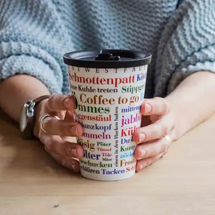 ORNAMIN Coffee to-go Mehrwegbecher mit Ostwestfählischem Wortschatz Dekor