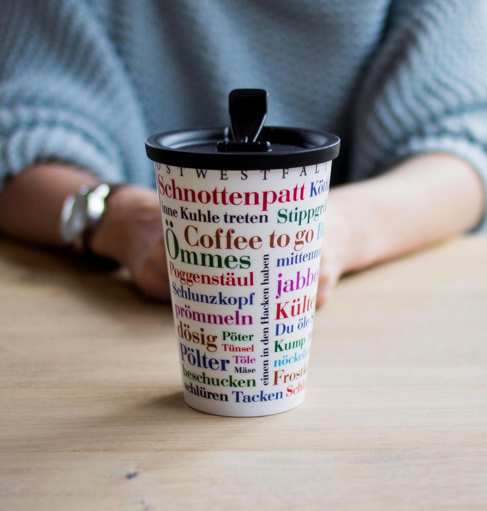 ORNAMIN-Coffee-to-go-Mehrwegbecher-Referenz-Ostwestfählischer-Wortschatz-Becher ORNAMIN Coffee to-go Mehrwegbecher mit Ostwestfählischer Wortschatz Dekor